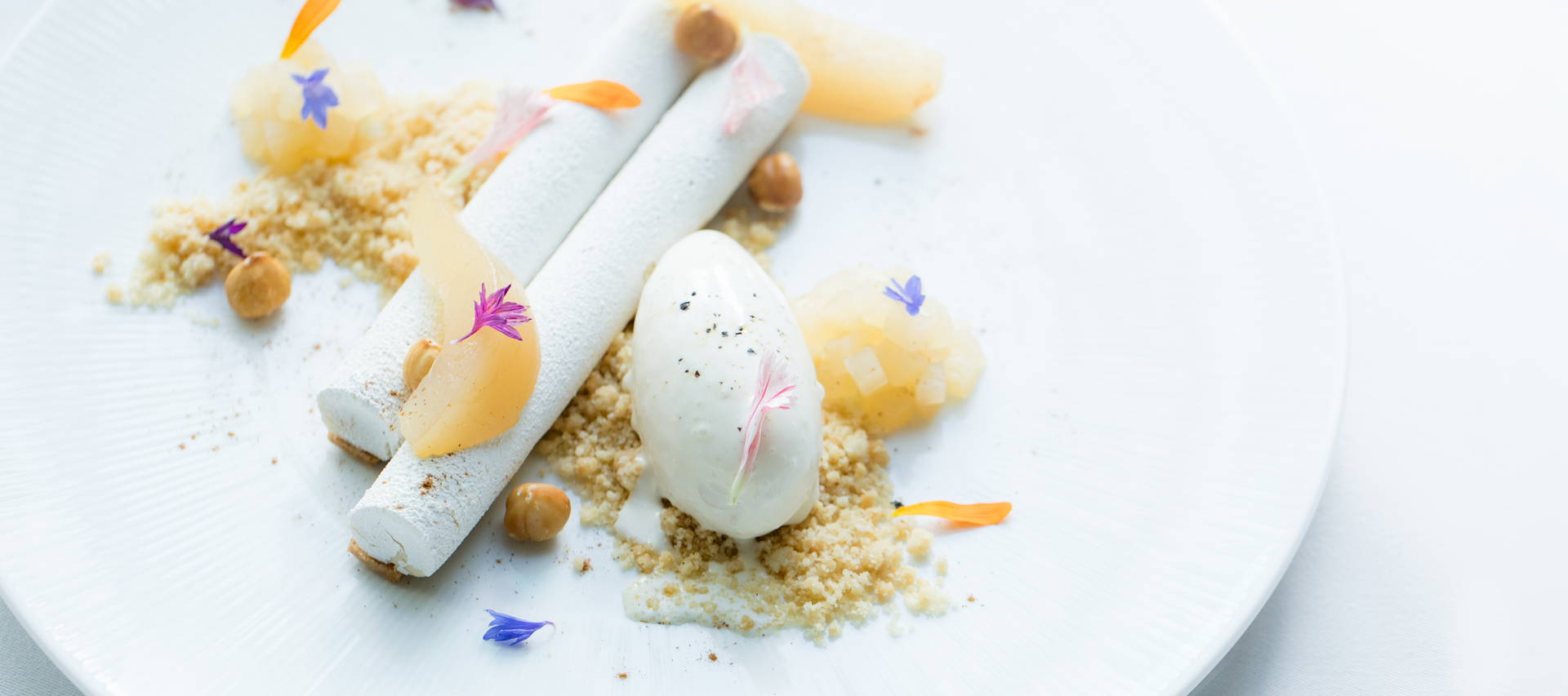 Nutcracker Mousse and poached Pear dessert recipe with cinnamon sable dough and hazelnut crumble